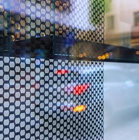 Reflection of street life in window glass