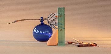 Geometry composition of glass, stone, dry flowers