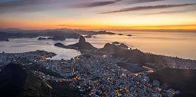 Beautiful landscape with a view to the city and mountains seen from Christ the Redeemer Statue (Cristo Redentor) on top of Corcovado Mountain (Morro do Corcovado) during the sunrise in Rio de Janeiro, Brazil