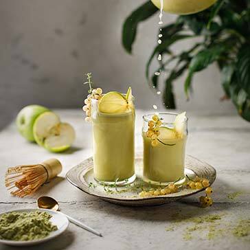 a cup with drink on a rustic wooden background